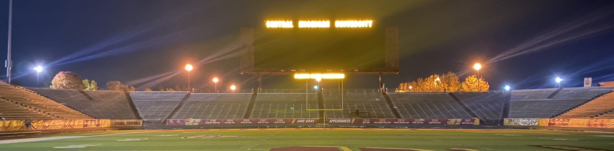 empty football stadium at night under the lights DC