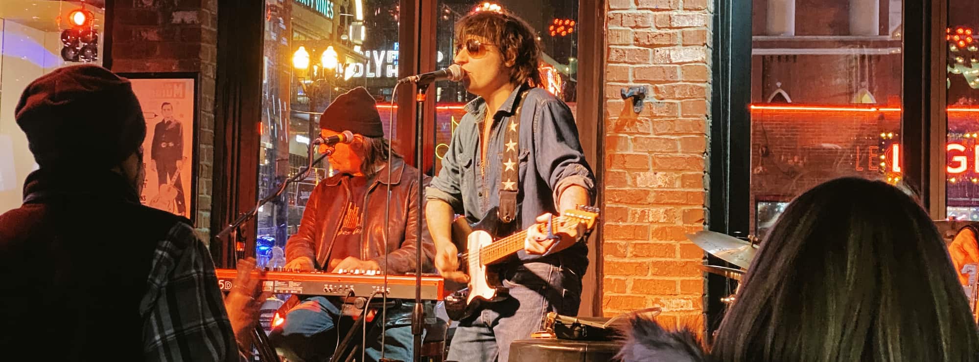 bar singer on guitar in DC