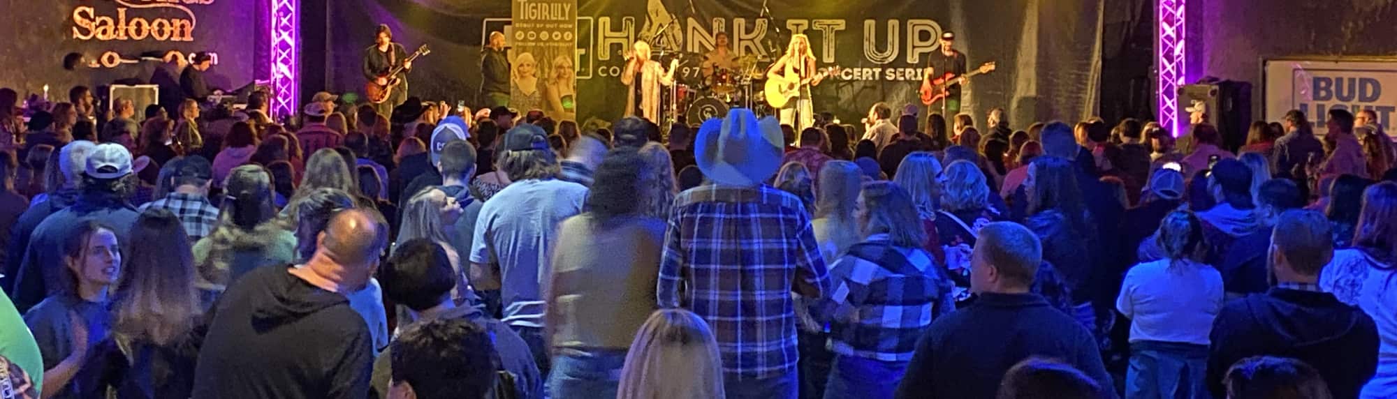 country concert with fans wearing cowboy hats DC